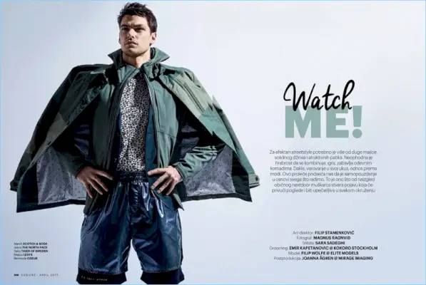 Filip Wolfe má na sobě kabát Scotch & Soda s bundou od The North Face. Modelka také nosí košili Tiger of Sweden a Levi