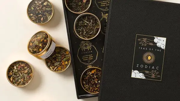 black box of 12 tea blends in small metal tins