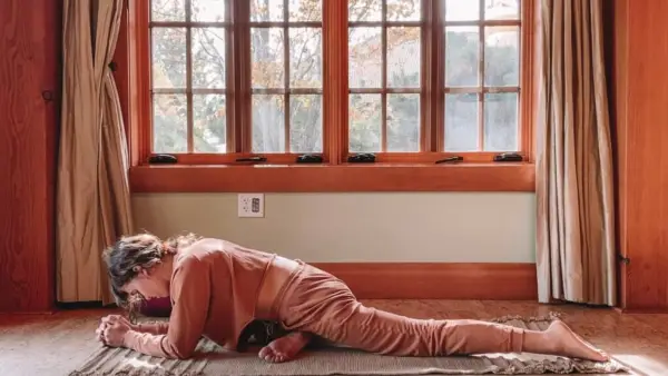 Woman lying on her yoga mat