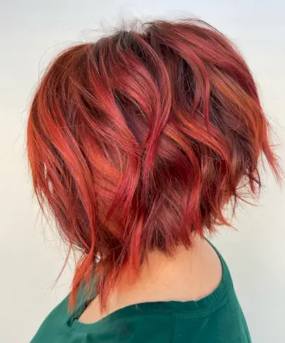 short and red angled asymmetrical bob
