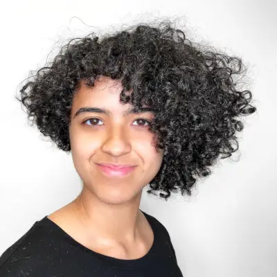 Asymmetrical bob haircut for curly hair