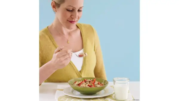 Woman Eating Breakfast