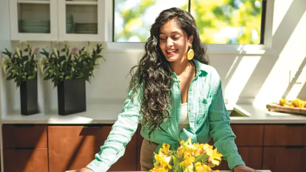 Radhi Devlukia-Shetty smiling in her kitchen