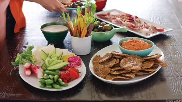 table of fresh veggies and party food