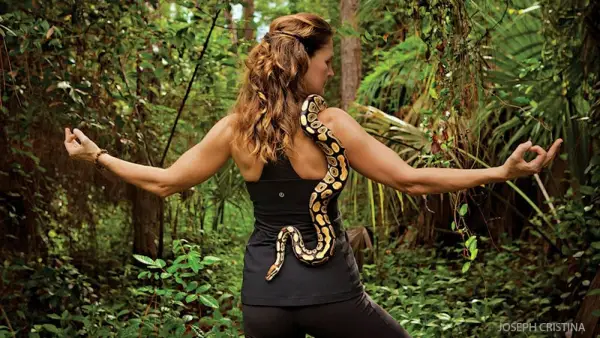 reader doing yoga with a snake