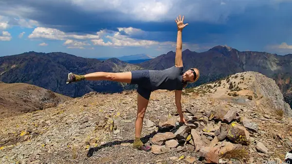 half moon pose on mountain