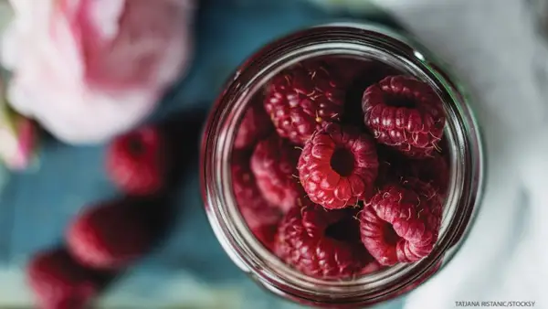 raspberries, glass jars