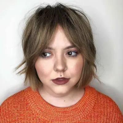 Low-Maintenance Shag with Bardot Bangs for Round Faces