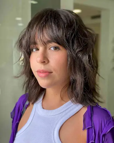 Blended Medium haircut with wispy bangs and textured layers