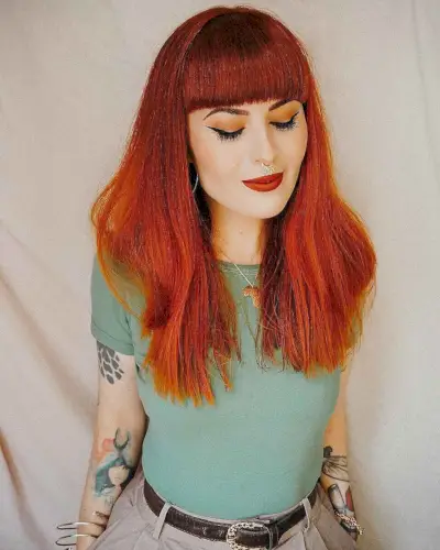 Blunt bangs on a square face