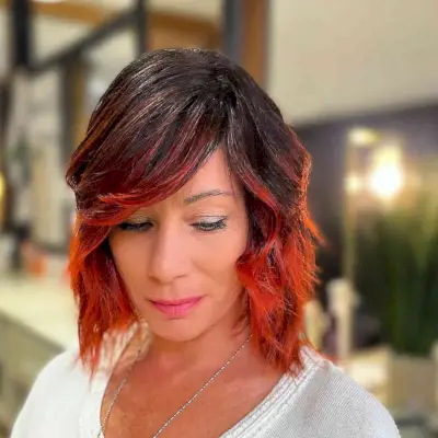 Red Balayage Choppy Bob with Sweeping Bangs