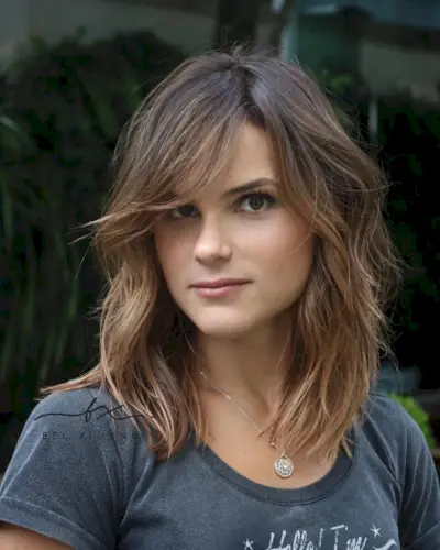 layered hair with side-swept bangs