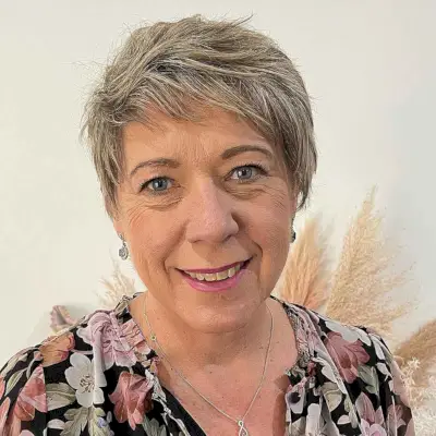 Cute pixie with side-swept bangs for older women