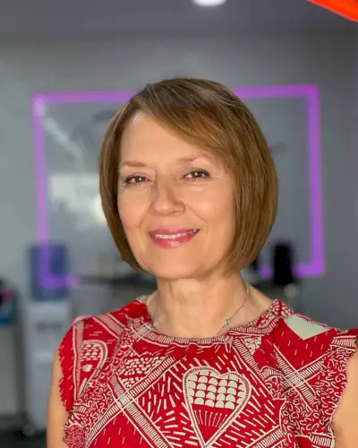 sleek short bob with side bangs for women over 60