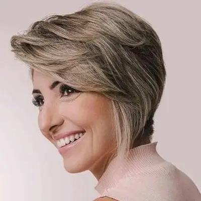 Sweeping Fringe on an Asymmetrical Long Pixie for women with a chic style