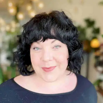 Curly Wavy Bob with Bangs for Round Faces