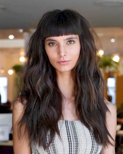 Mature dark long hair with blunt bangs