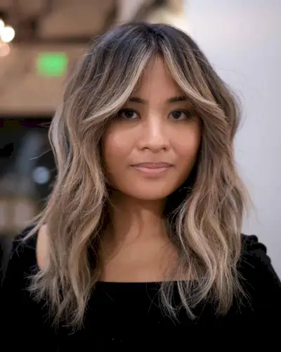 Wavy Hair with Curtain Bangs and Money Pieces