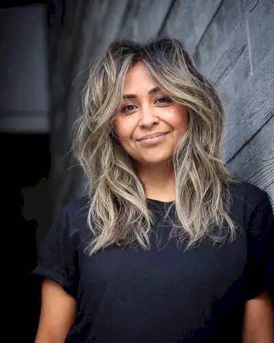 Face-Framing Fringe on Tousled, Wavy Hair