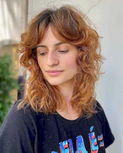 Medium Haircut with Messy Waves and Bangs