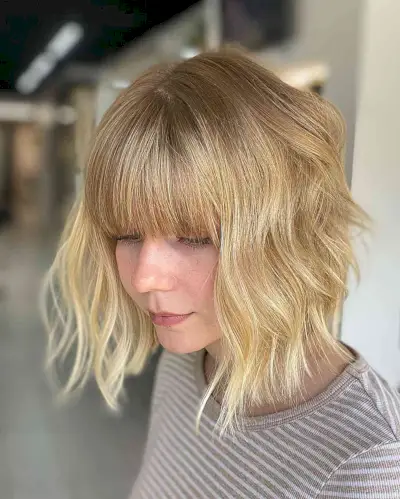 Short A-Line Wavy Blonde Bob with Full Bangs