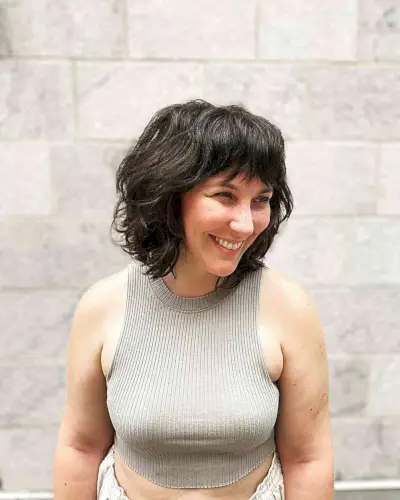 Neck-Grazing Layered Bob with Textured Waves and Fringe
