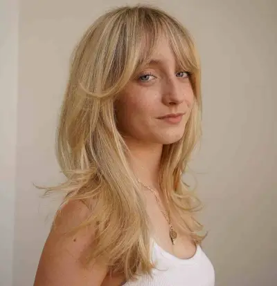 Soft & stunning curtain bangs on long blonde hair