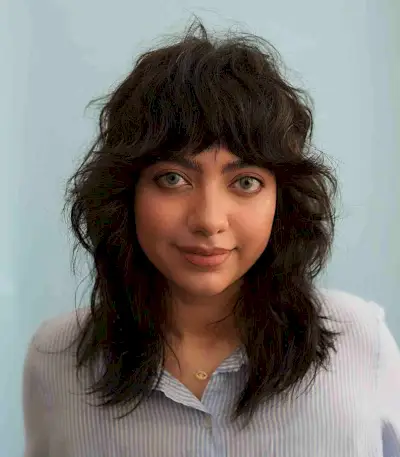 Beautiful Mid-Length Cut with Full Curtain Bangs