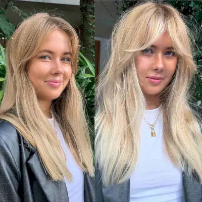 Blonde Long Layered Hair with Eye-Catching Curtain Bangs on an oval face