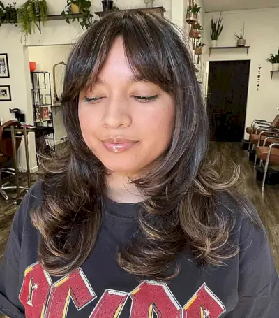 Chest-length Layered Cut and Long Curtain Fringe for Round Faces