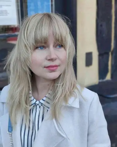 Brow-Skimming Bangs for Round Face Shapes