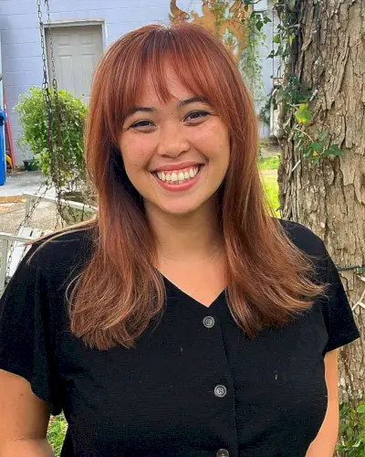 Medium Jagged Layers and Piece-y Bangs on Fuller Face Shapes