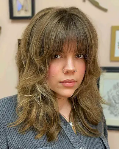 Soft Shaggy Layers and a Wispy Fringe on a messy thick medium-length hairstyle
