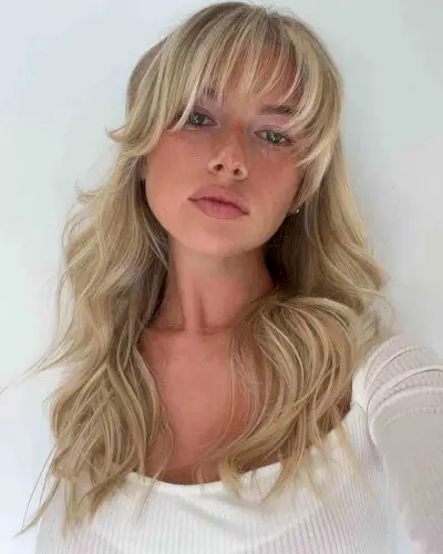 Creamy Blonde Beach Waves and Wispy Bangs
