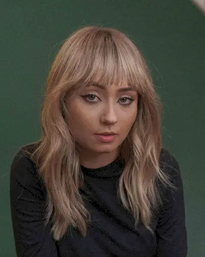 Chic and Tousled Mid-Length Cut with Choppy Fringe