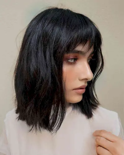 Jet Black Textured Layers and Choppy Bangs