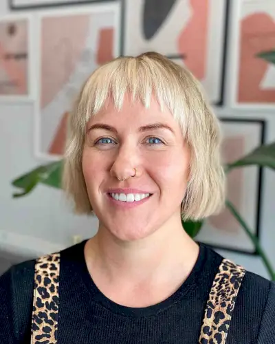 Choppy bangs on a jaw-length blunt bob cut