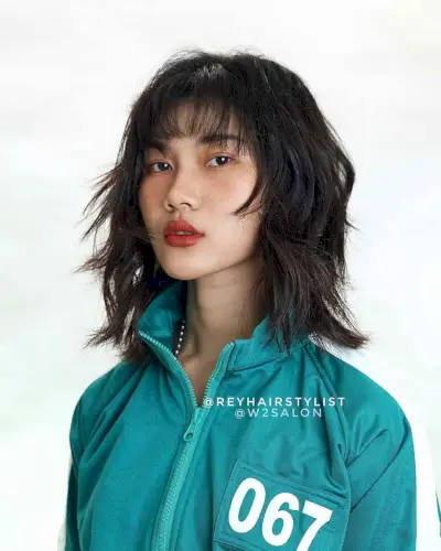 Layered Wolf Haircut with a Fringe