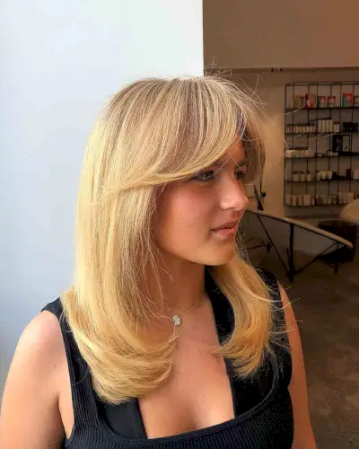 Layered Straight Hair with Long Curtain Bangs