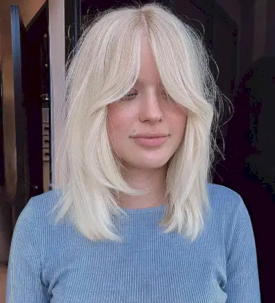 Soft Shag Cut with Face-Framing Layers and Bottleneck Bangs