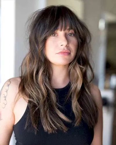 Soft Waves and Face-Framing Bottleneck Bangs for Long Hair