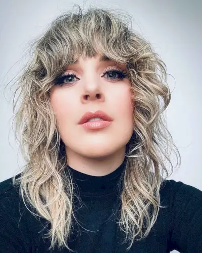 Sassy Medium-Length Wavy Hair with Bangs