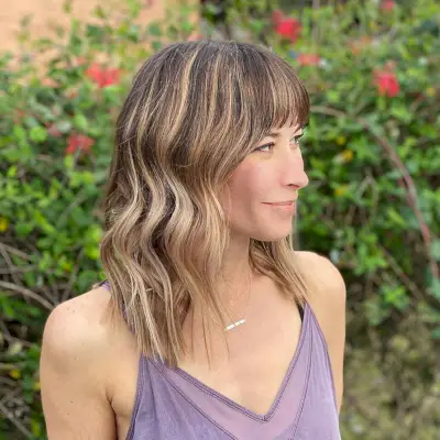 Soft Wavy Hairstyle with Blunt Bangs
