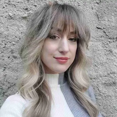 Medium-to-Long Ash Blonde Wavy Hair with Wispy French Fringe