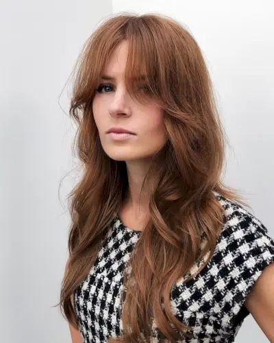 Long layered hair with long curtain bangs