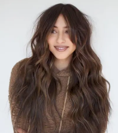 Long curtain bangs on long wavy hair