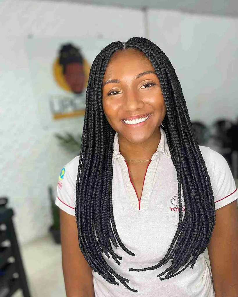 Lange boxvlechten met een middendeel' title=