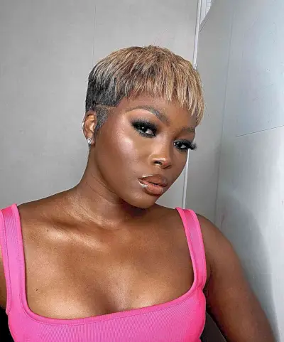 Short black bowl cut with a weave