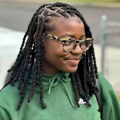 Medium Knotless Faux Locs Twists for Natural Hair with Side Part Style