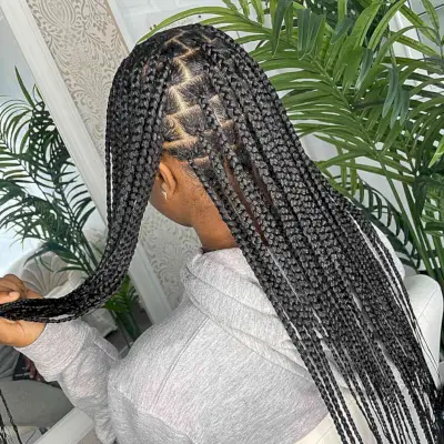 Long and Black Medium-Sized Knotless Braids with Sleek Baby Hairs